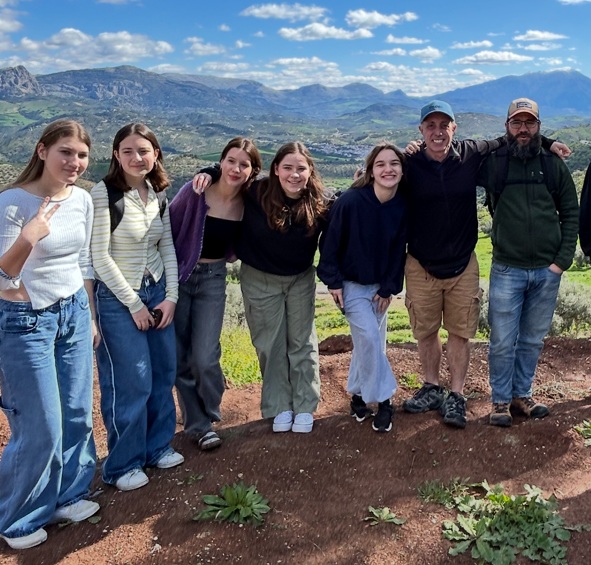 Students and teacher on a mountaintop adventure